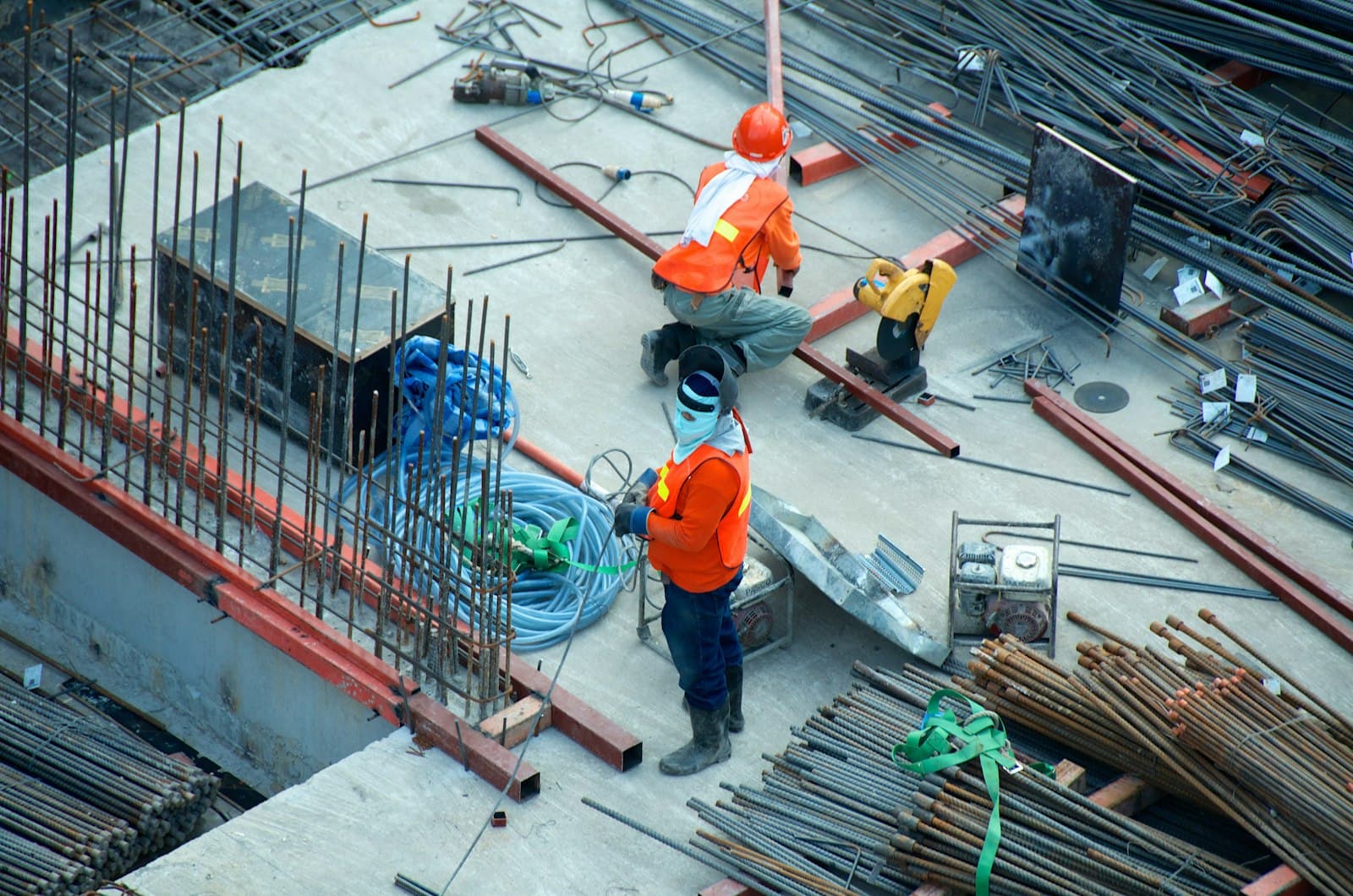 Construction crew working on a wood-framed job site
